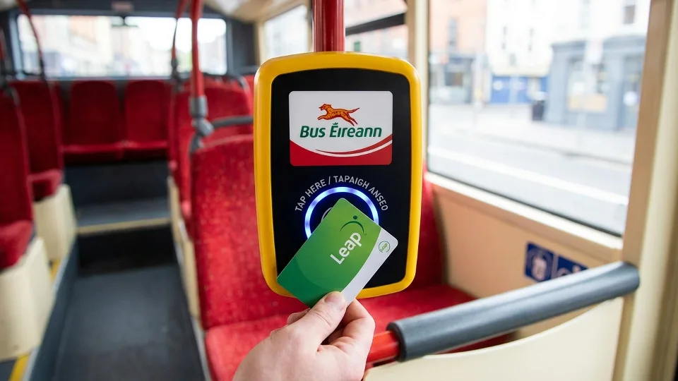 Close-up of Leap Card being tapped on bus fare reader with Bus Éireann branding