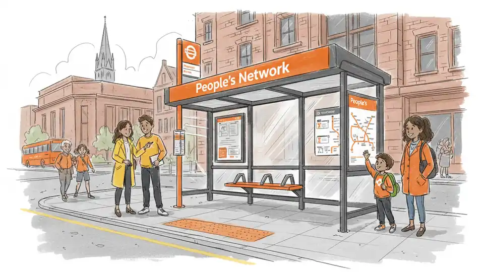 South Yorkshire bus stop with new molten orange People's Network branding, showing updated signage and wayfinding elements, urban street setting with clear visibility of rebranded transit infrastructure