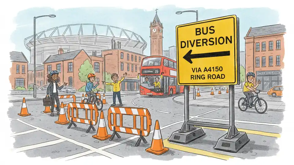 Bus diversion sign at Wolverhampton junction showing alternate route directions with road work barriers and traffic cones in foreground