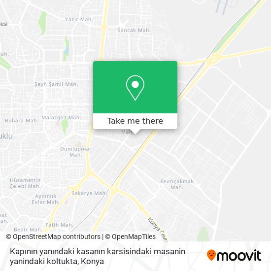 Kapının yanındaki kasanın karsisindaki masanin yanindaki koltukta map